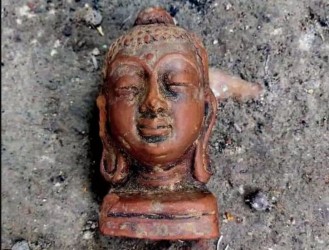 Buddha head, copper coins found in ancient mound in Mahpur village